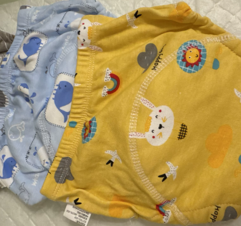 Enfant dormant avec l'oreiller Le P'tit Loup