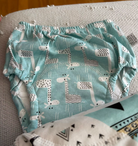 Enfant dormant avec l'oreiller Le P'tit Loup